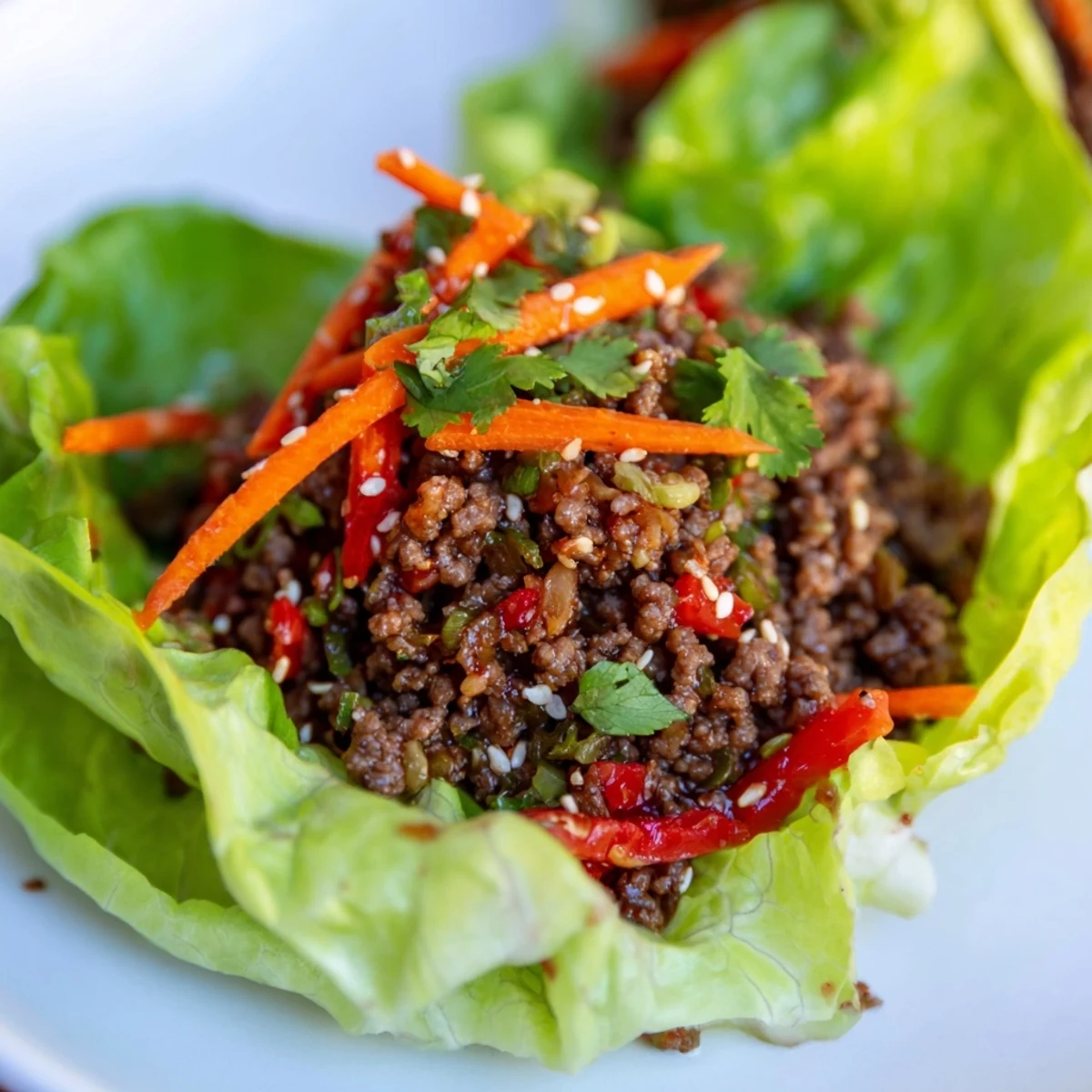 Golden ground beef, sautéed with ginger and garlic, fills tender lettuce leaves, creating a juicy, aromatic, and satisfying bite.