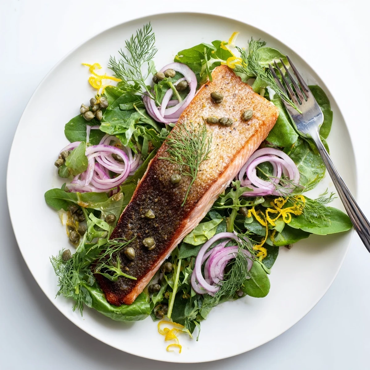 Freshly seared Tasmanian Atlantic salmon featuring crunchy skin, paired with bright greens and dill for a quick dinner.