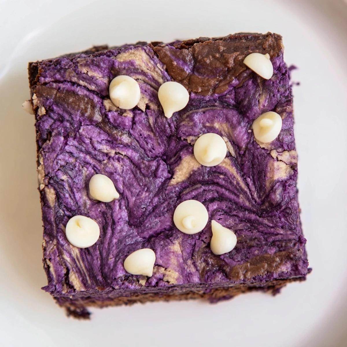 Rich Filipino-style ube brownies displaying fudgy texture with chocolate swirls