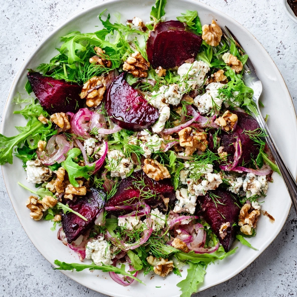 Rustic wooden bowl serving ultimate beet salad with tangy vinaigrette and vibrant mixed greens