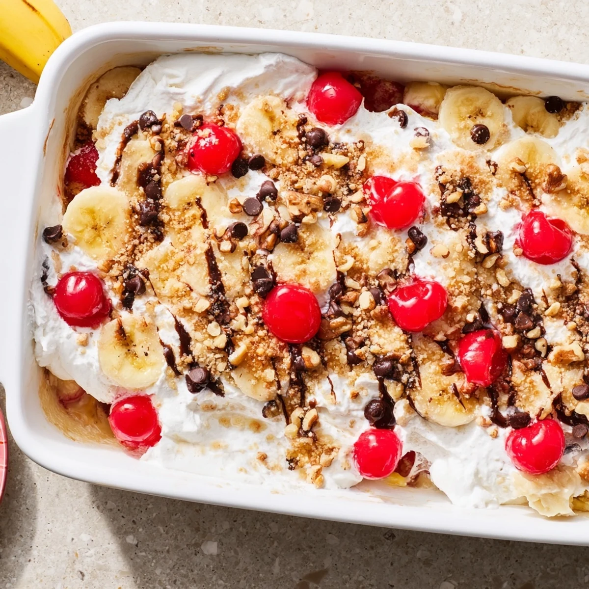 Golden banana split dump cake with bubbling fruit layers and melted chocolate chips