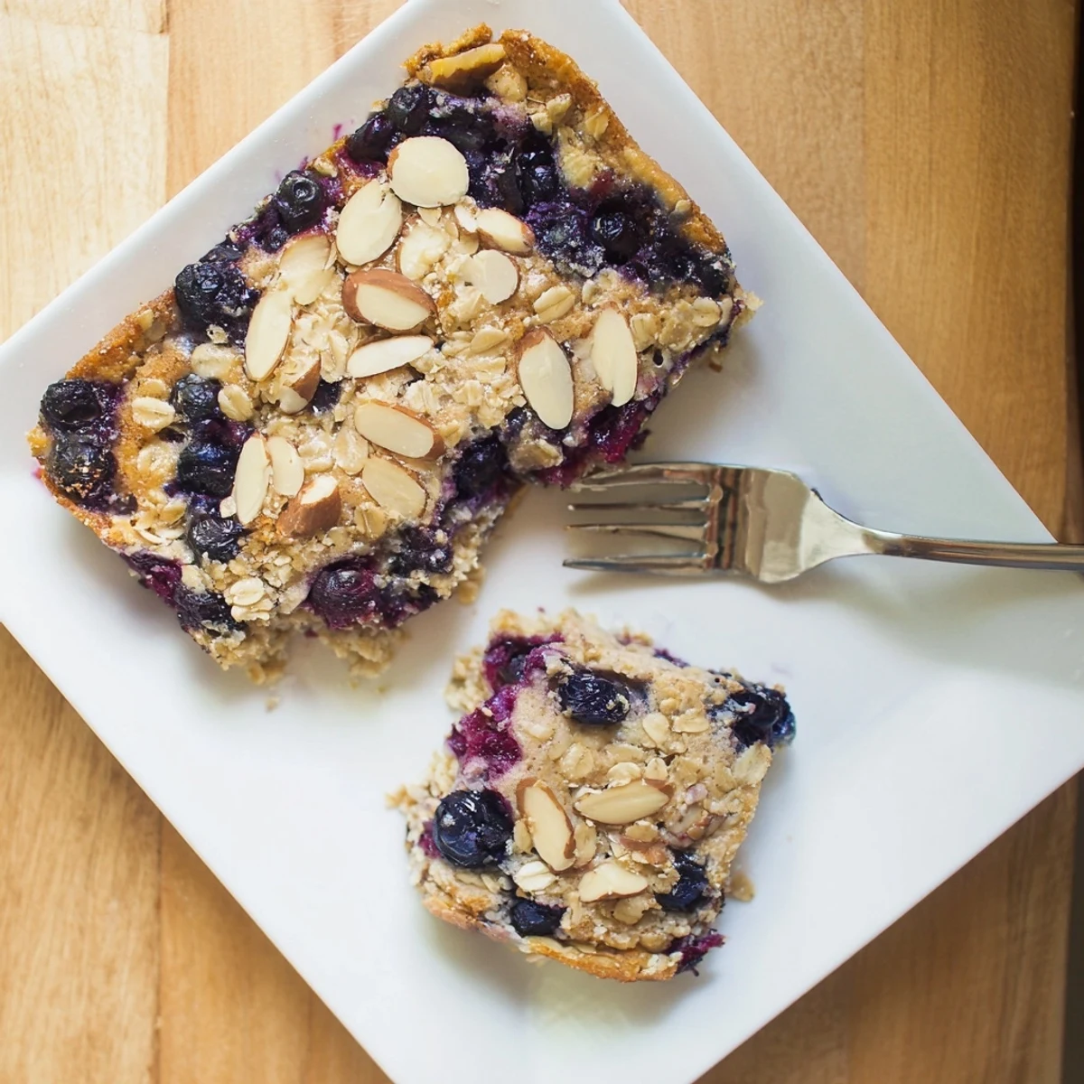 Freshly baked blueberry cottage cheese breakfast bake sprinkled with almonds and coarse sugar