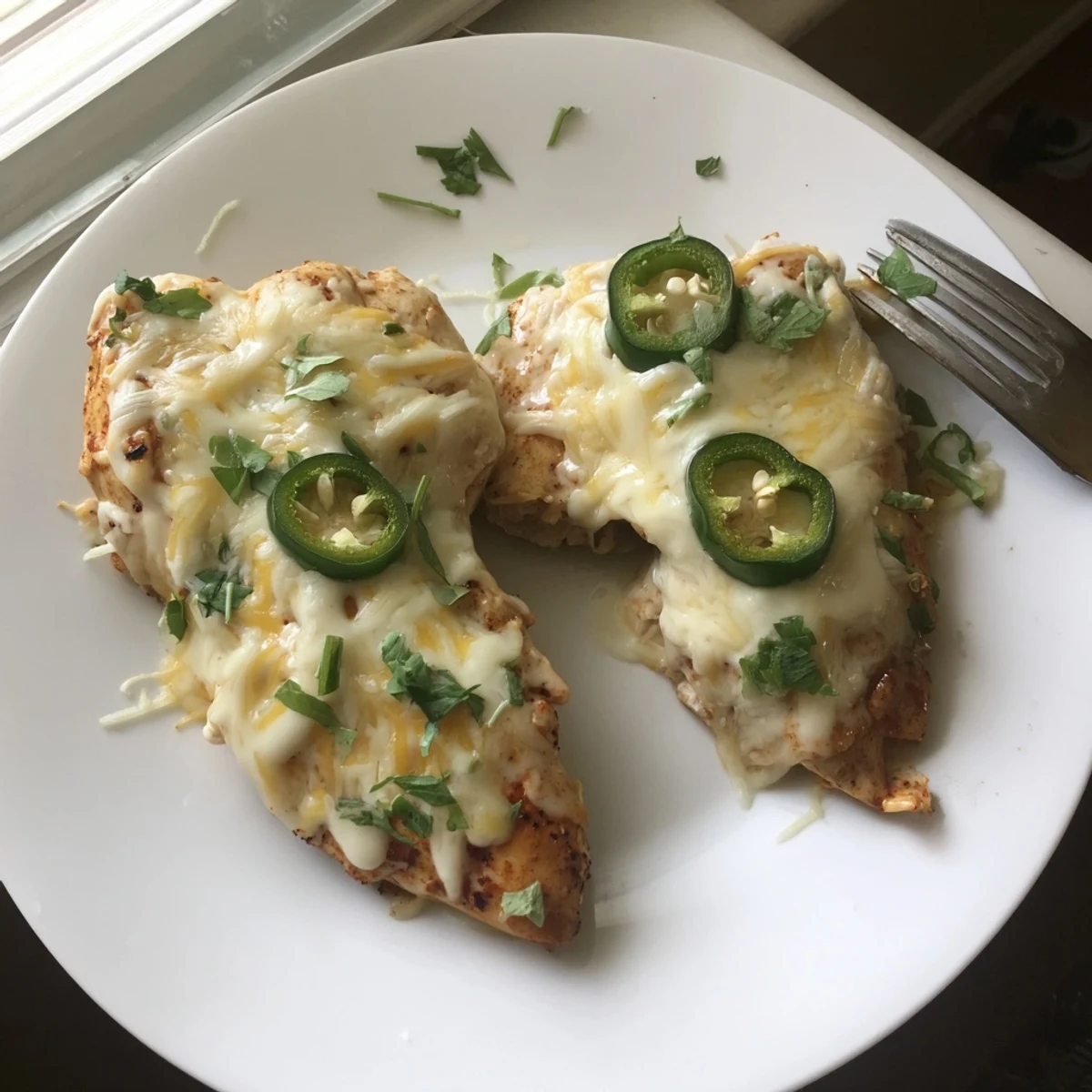Creamy jalapeno chicken with tender spiced meat and sliced peppers in rich velvety cheese sauce