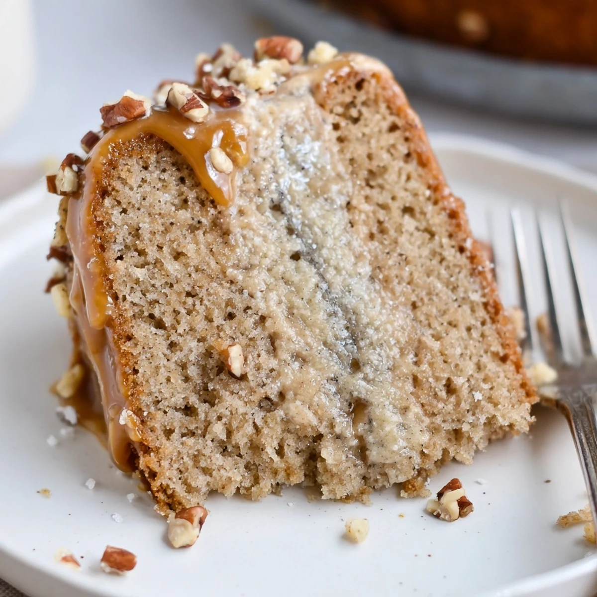 Warm Salted Caramel Brown Butter Banana Cake Recipe slice steaming on plate