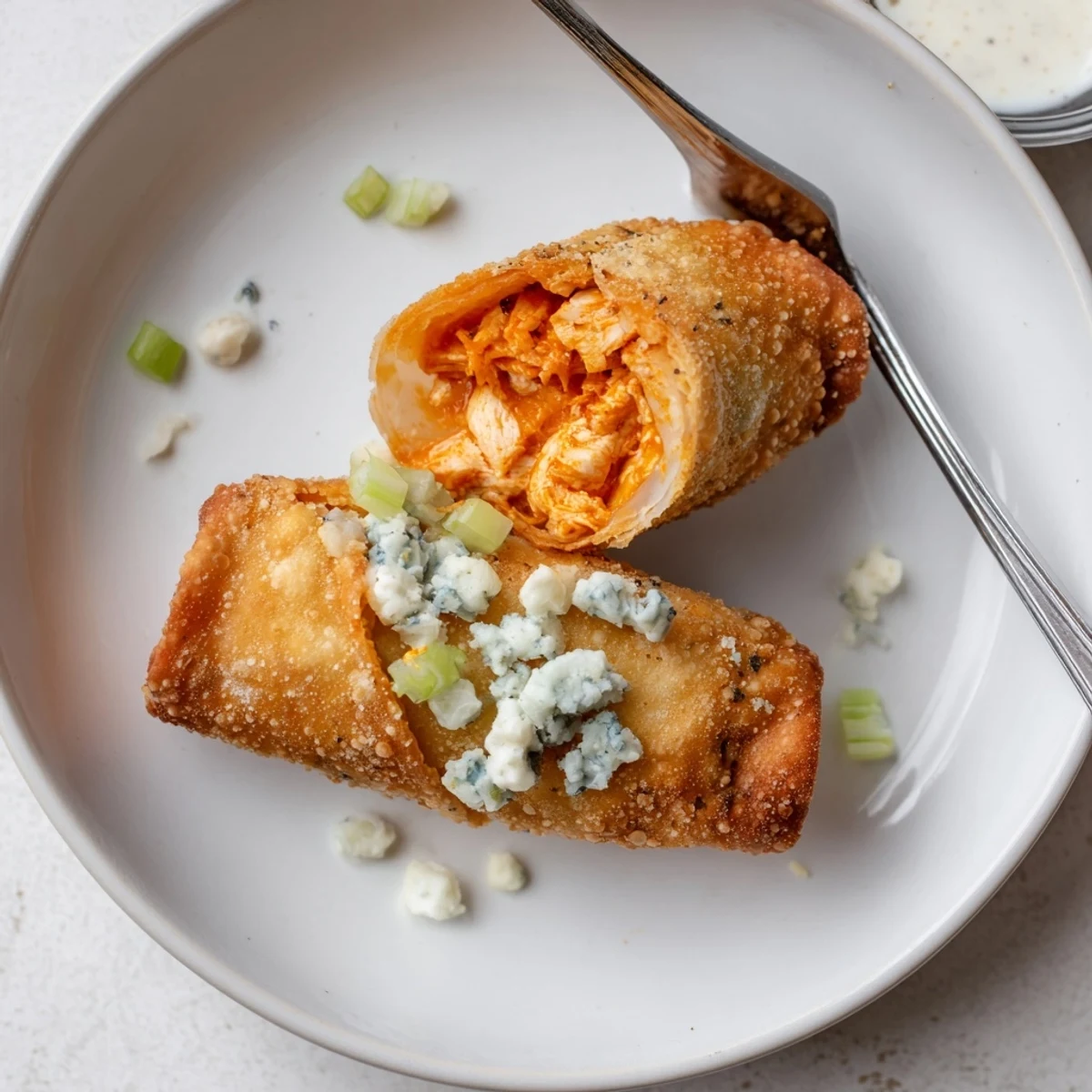 Warm Buffalo Chicken Egg Rolls served right from the hot fryer.