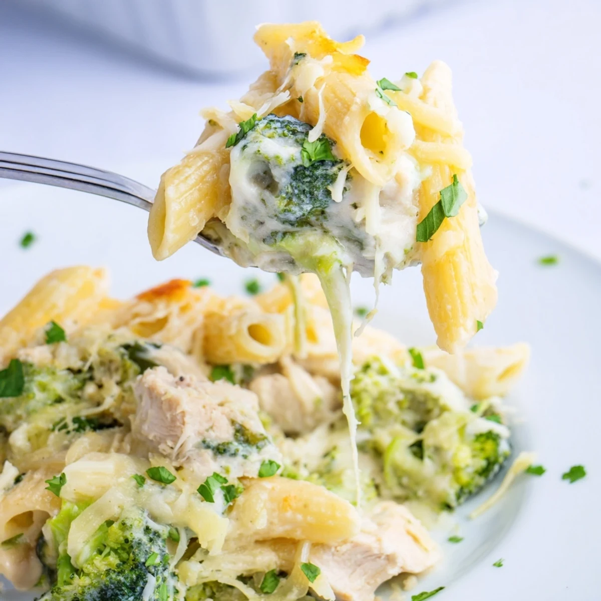 Family style Chicken Broccoli Alfredo Bake with tender shredded chicken and bright florets