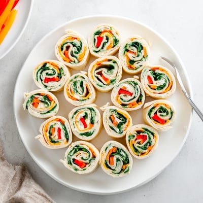 Chilled Pinwheel Sandwiches sliced into bite-sized swirls, perfect for picnic trays